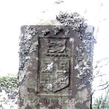 2. Crest at the top of the main headstone