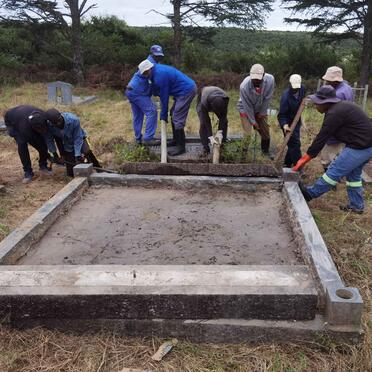 4a. Busy repairing the grave